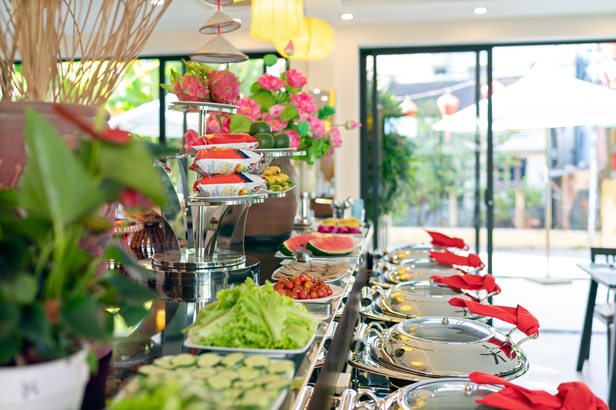 Close-up of the breakfast buffet spread — fresh fruit, salad and chafing dishes
